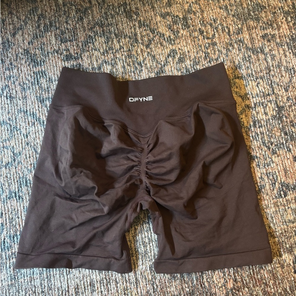 Brown butt-scrunched athletic shorts